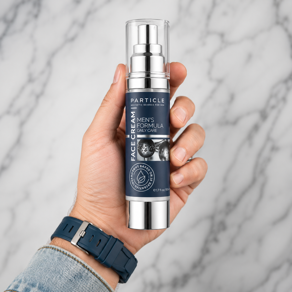 Men holding a bottle of Particle Men's Formula Face Cream