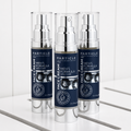 Three bottles of Particle Men's Formula Face Cream