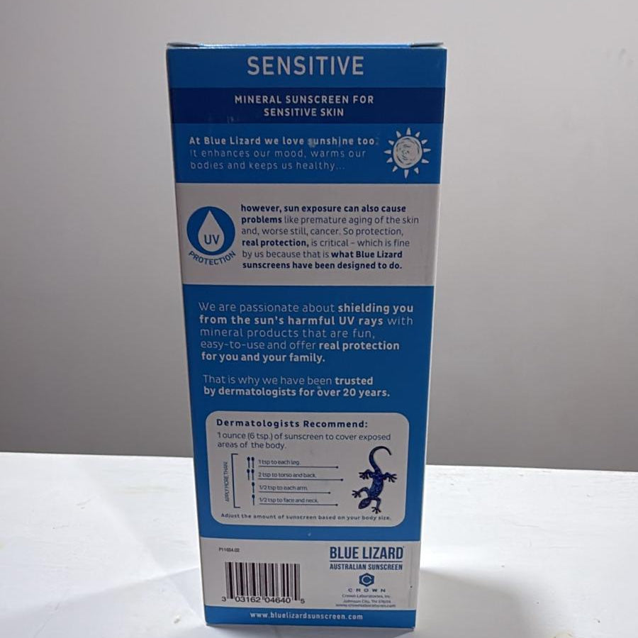 The back of a Blue Lizard Sensitive Mineral Sunscreen box, showing product details, ingredients, and instructions on a white surface against a light gray background.